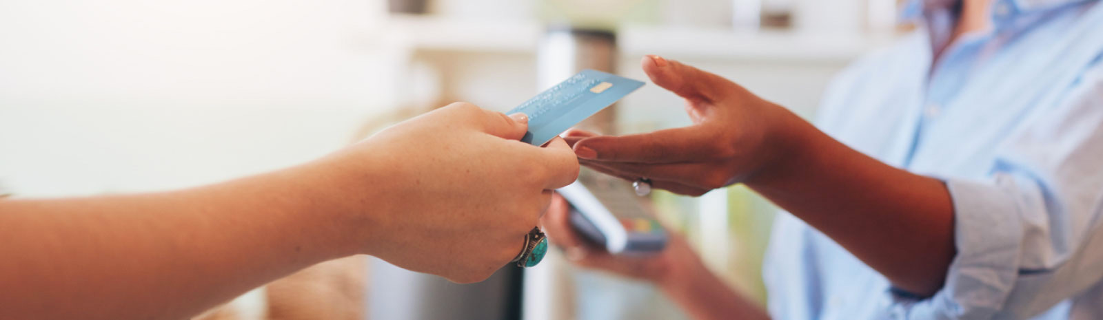 Card being handed to employee