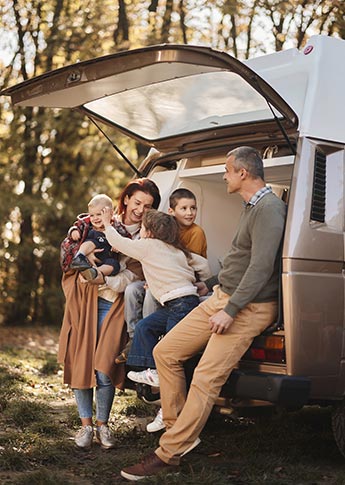 Young family in the back of their new RV
