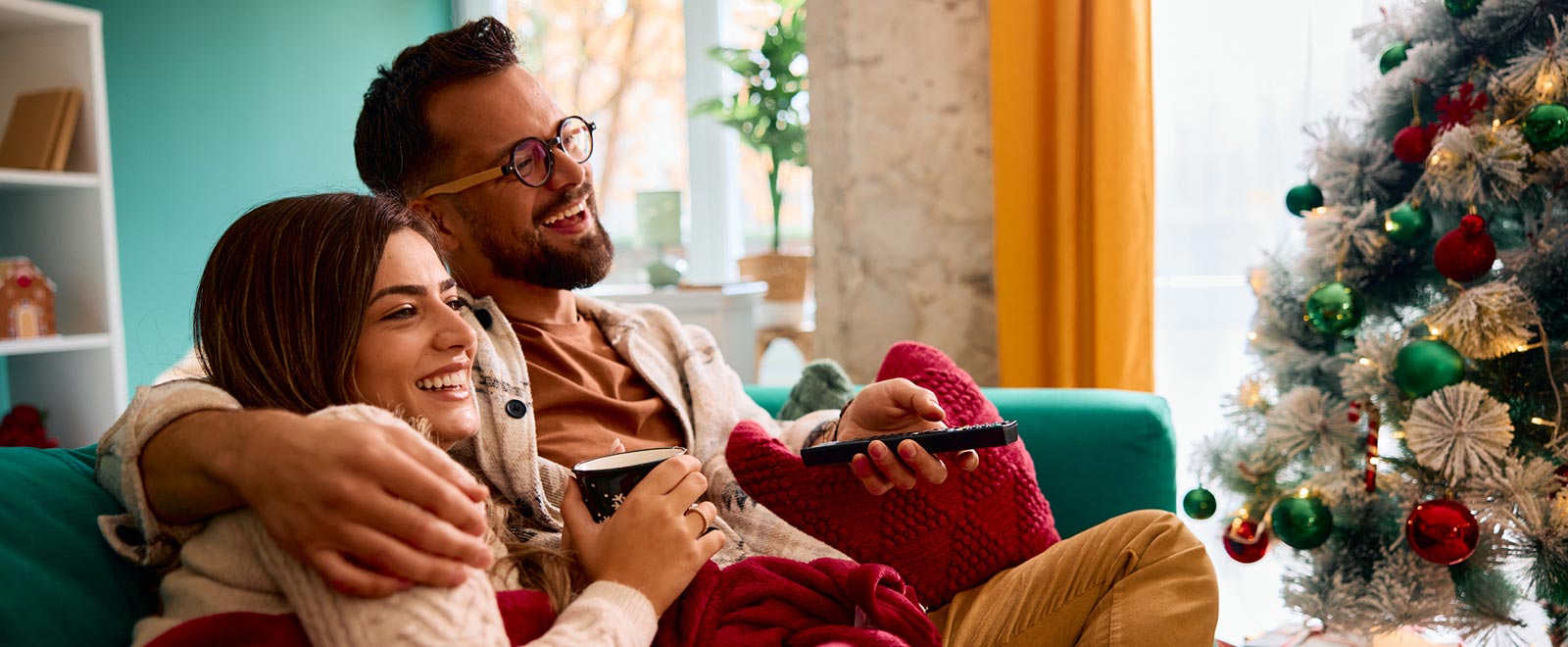 Young couple in living room during Christmas