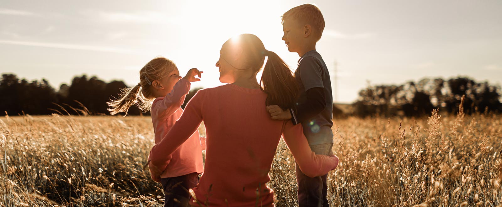 Mother and children in wheat field