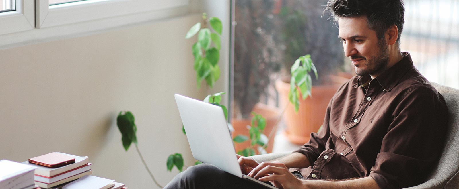 Man using laptop in home office